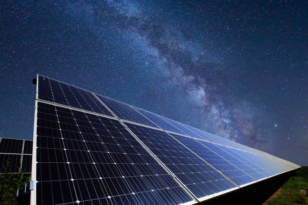 solar panels under a starry sky